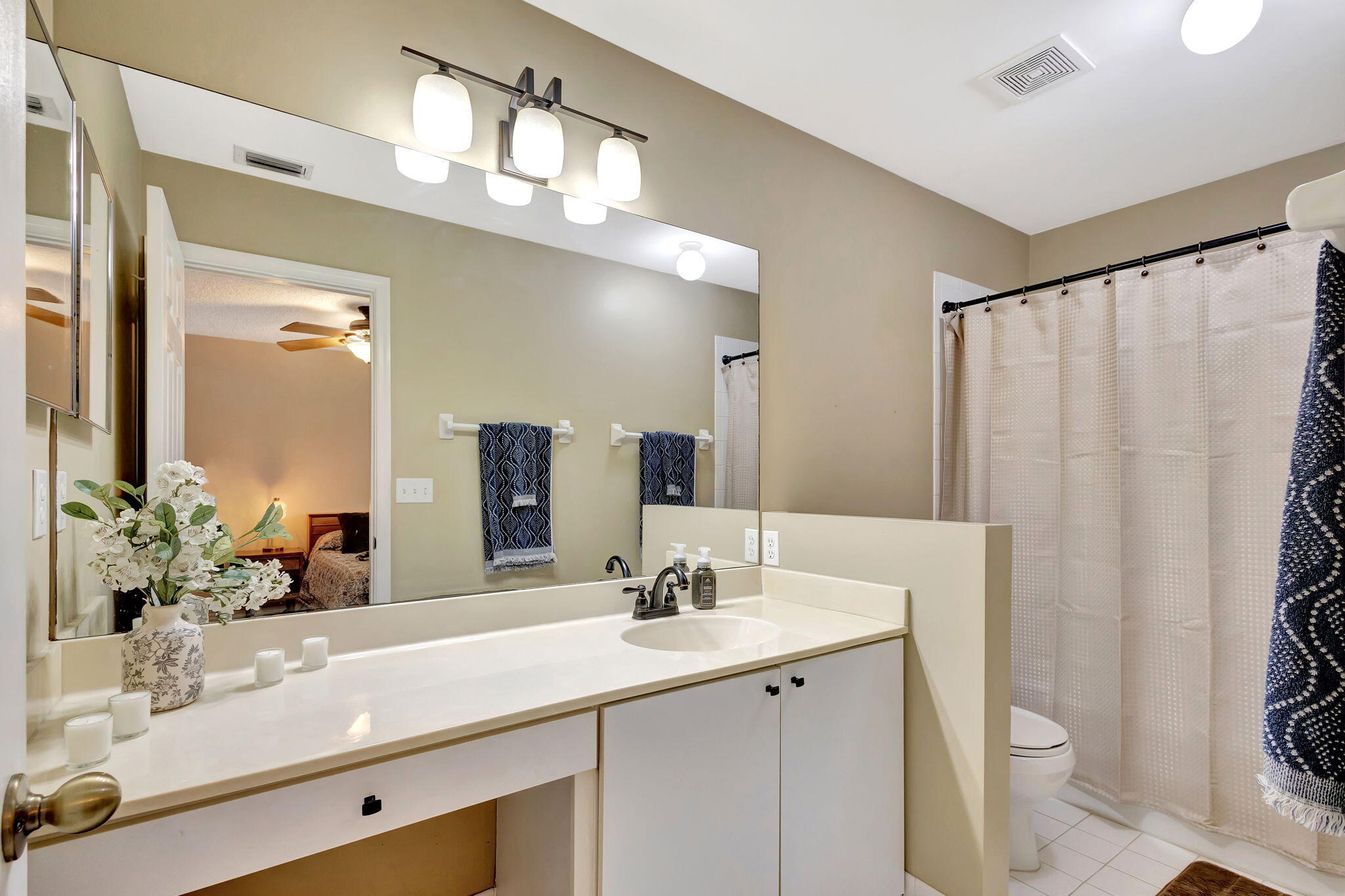 145 Timberwalk Trail Jupiter, FL 33458 - Photo 29 of 61 a bathroom with double vanity sink a toilet a mirror and shower