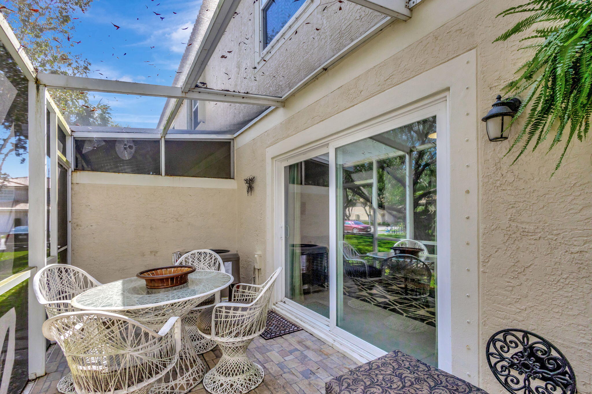 145 Timberwalk Trail Jupiter, FL 33458 - Photo 39 of 61 a patio with table and chairs and potted plants
