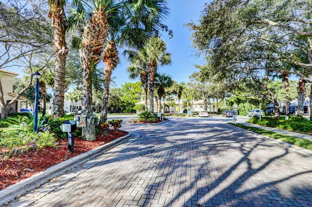 an aerial view of residential houses with outdoor space and river view