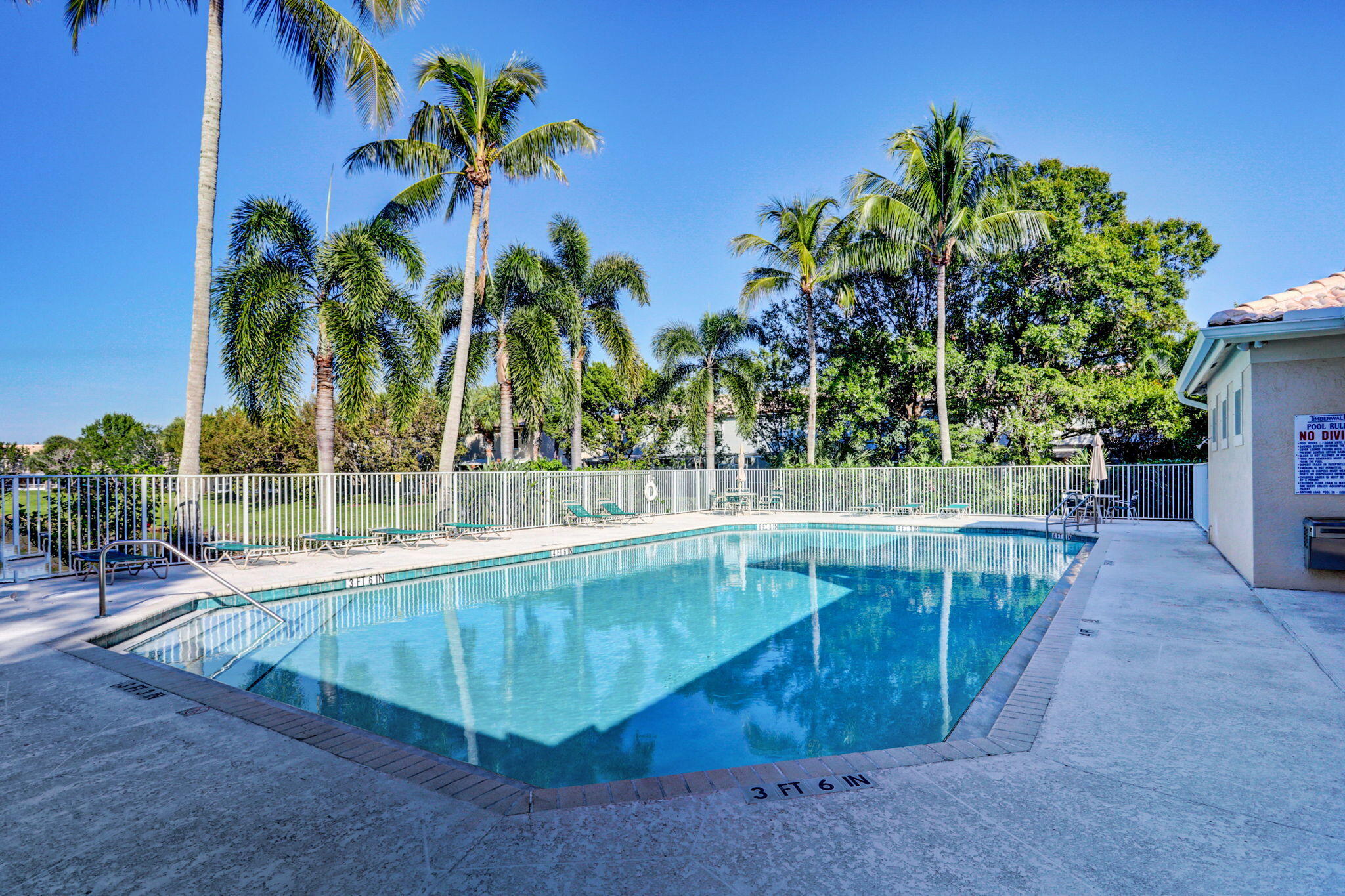 145 Timberwalk Trail Jupiter, FL 33458 - Photo 44 of 61 a view of a swimming pool with a patio