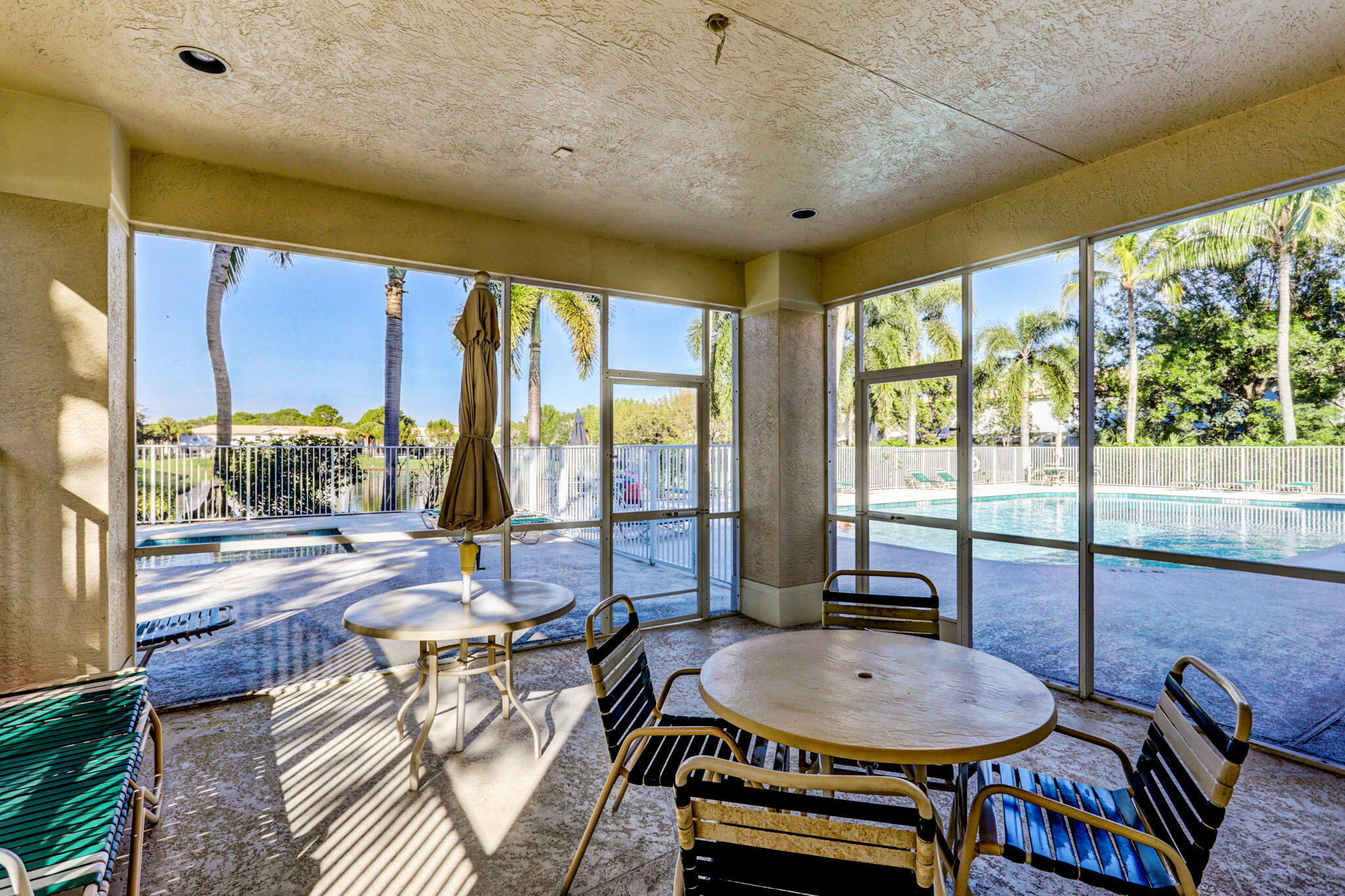 145 Timberwalk Trail Jupiter, FL 33458 - Photo 46 of 61 a dining room with furniture a chandelier and wooden floor