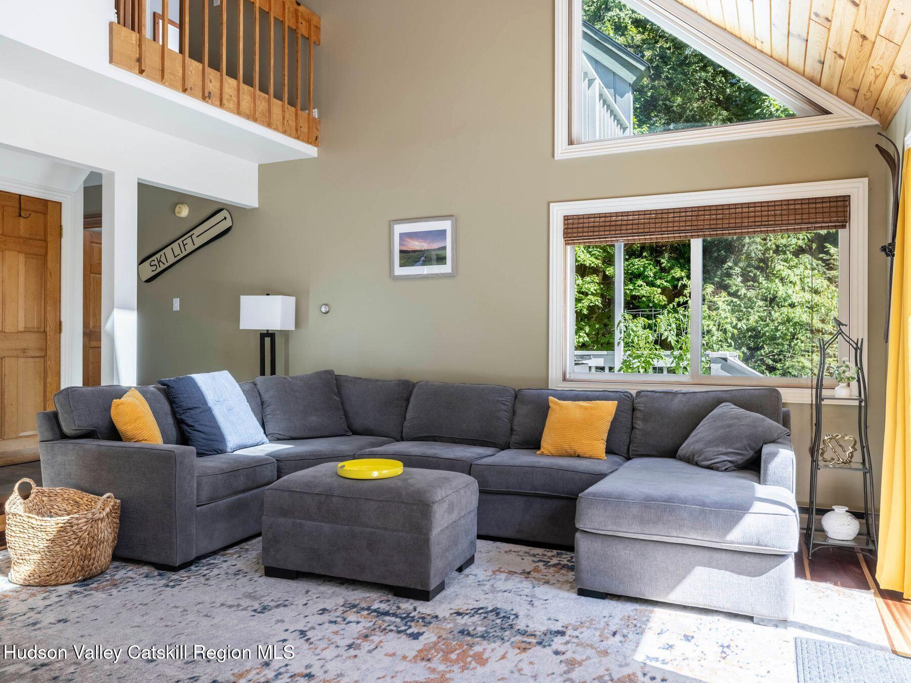 36 Mt Greenery Road Windham, NY 12496 - Photo 16 of 60 a living room with furniture and a large window
