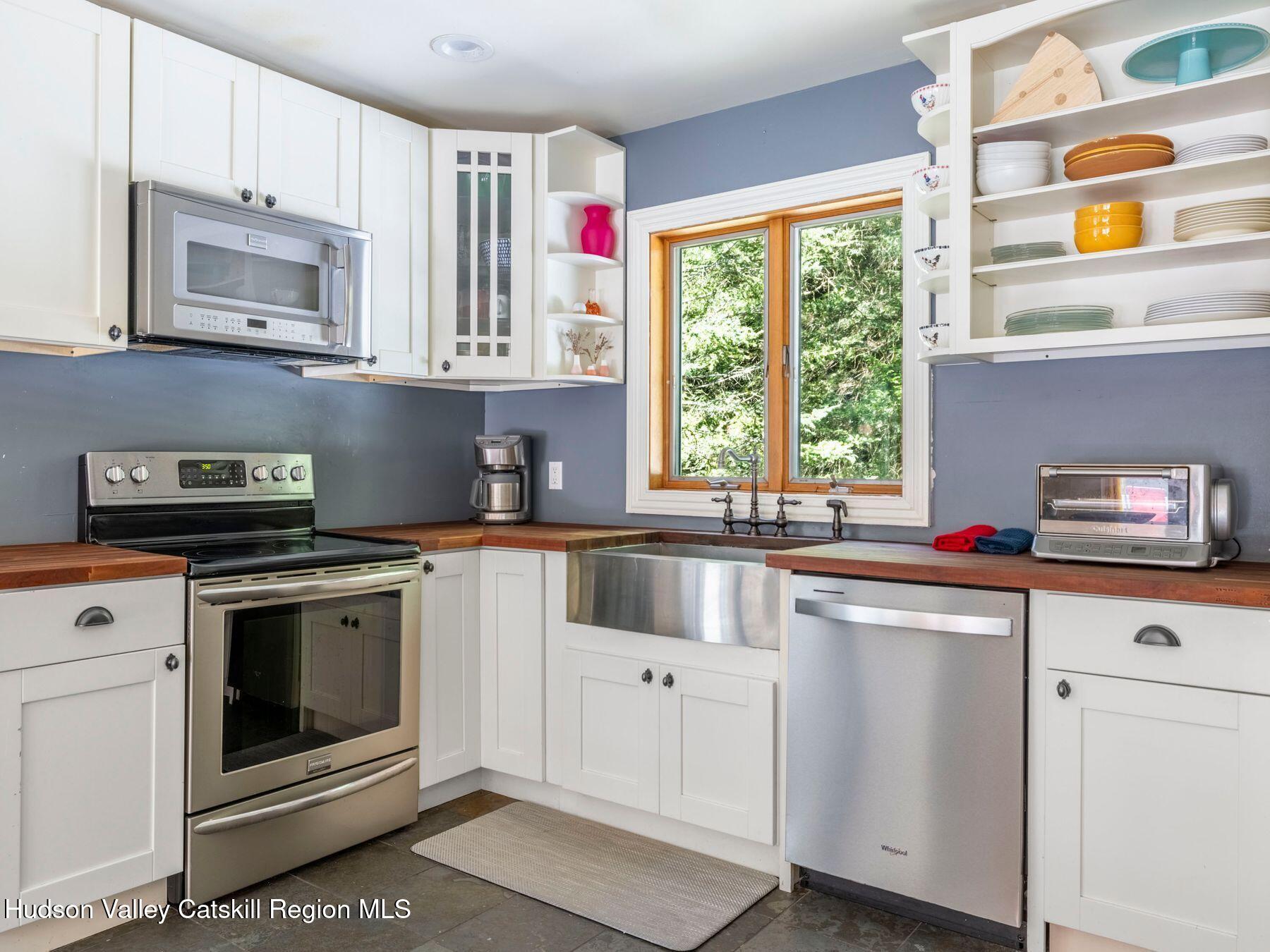 36 Mt Greenery Road Windham, NY 12496 - Photo 19 of 60 a kitchen with cabinets appliances and a window