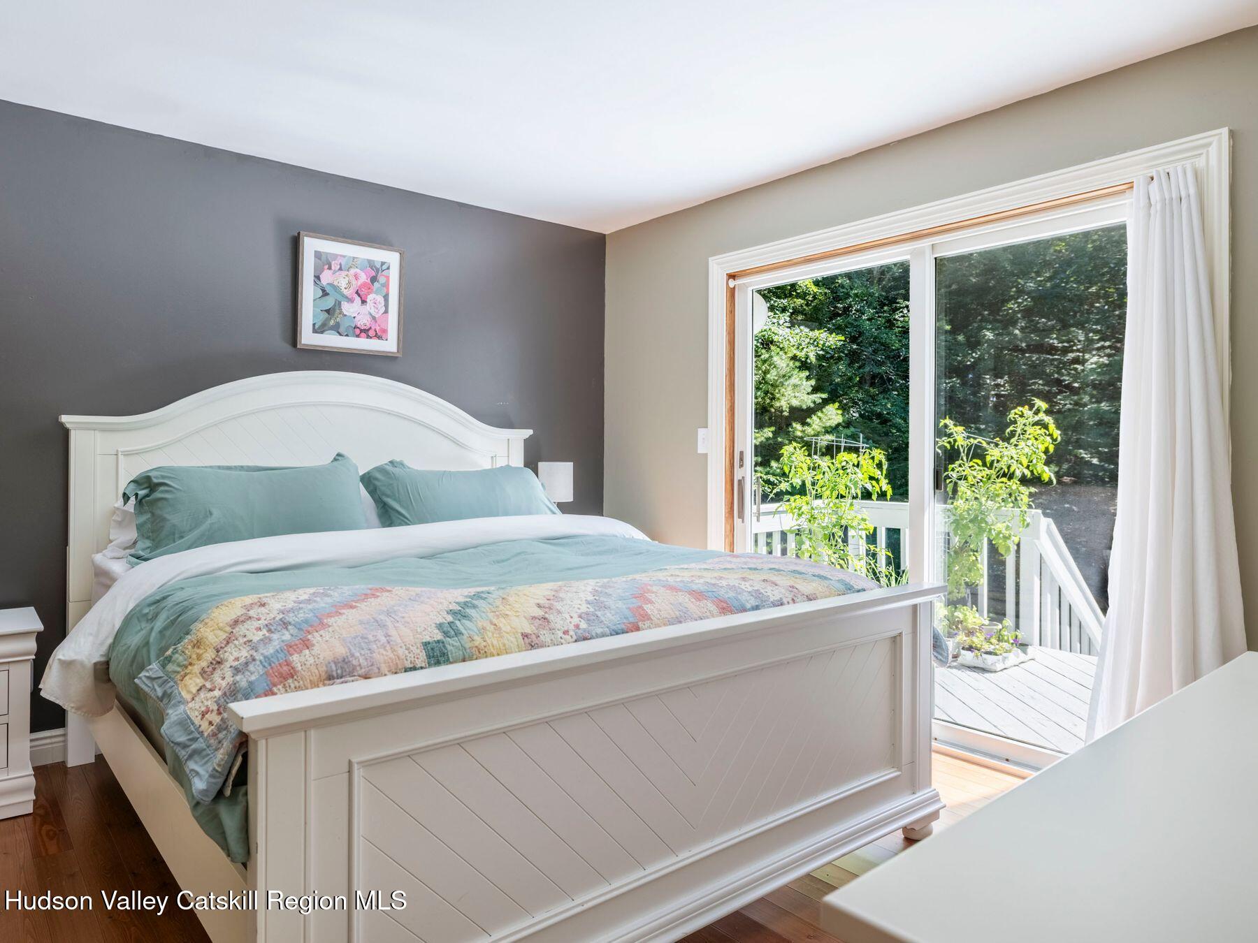 36 Mt Greenery Road Windham, NY 12496 - Photo 23 of 60 a bedroom with a bed and a large window