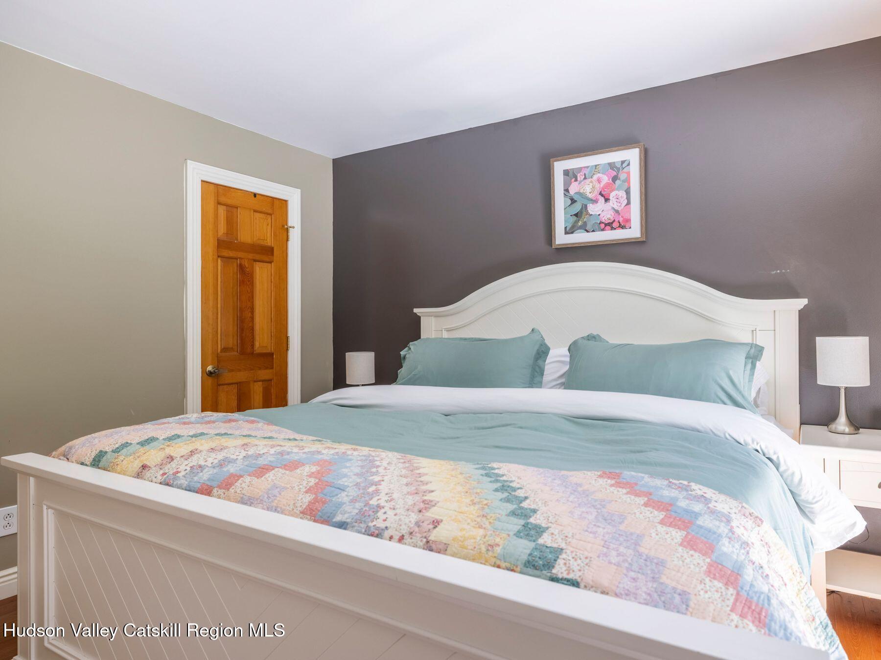 36 Mt Greenery Road Windham, NY 12496 - Photo 24 of 60 a bedroom with a bed and a painting on the wall