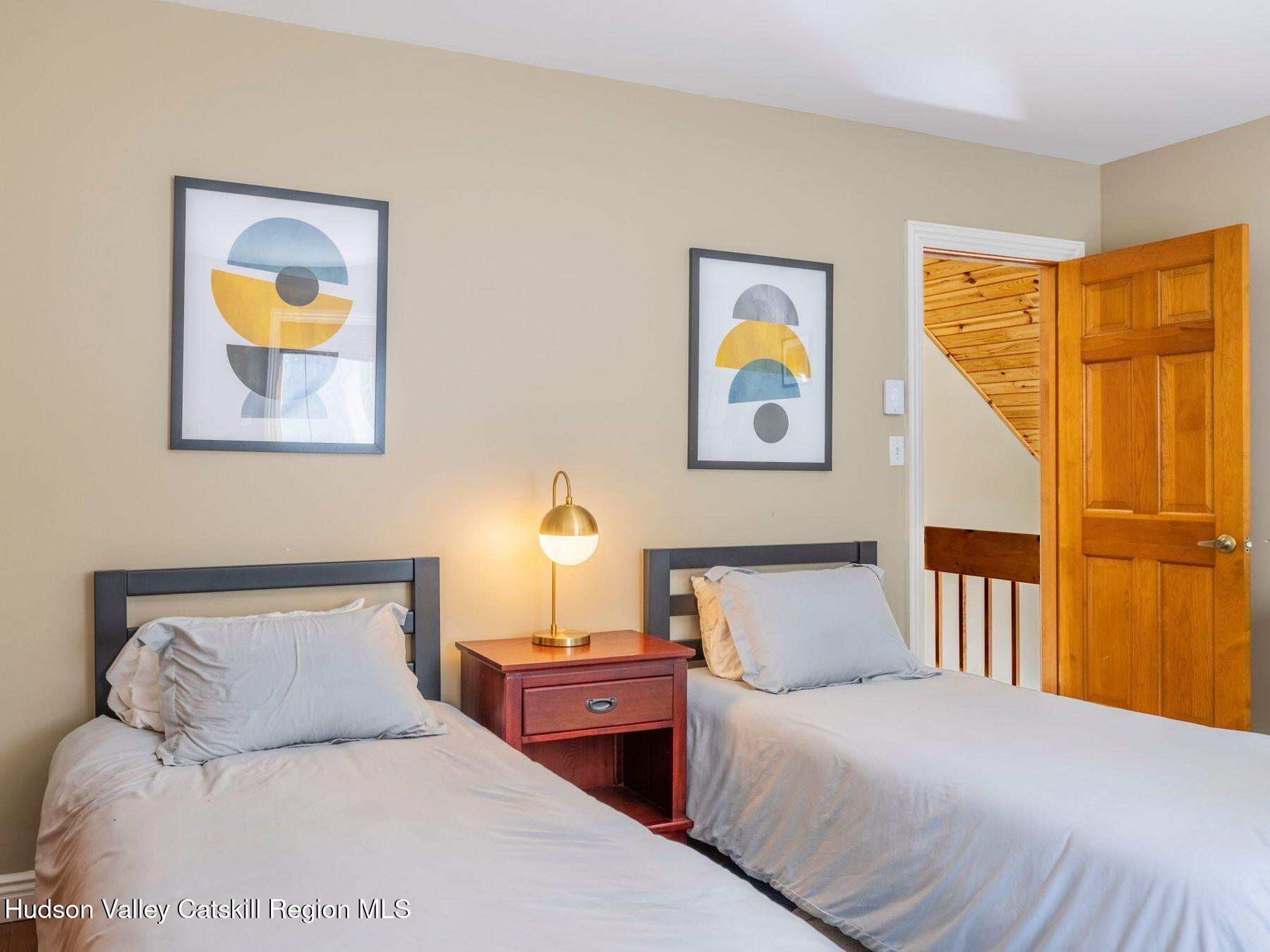 36 Mt Greenery Road Windham, NY 12496 - Photo 26 of 60 a bedroom with a bed and painting on the wall