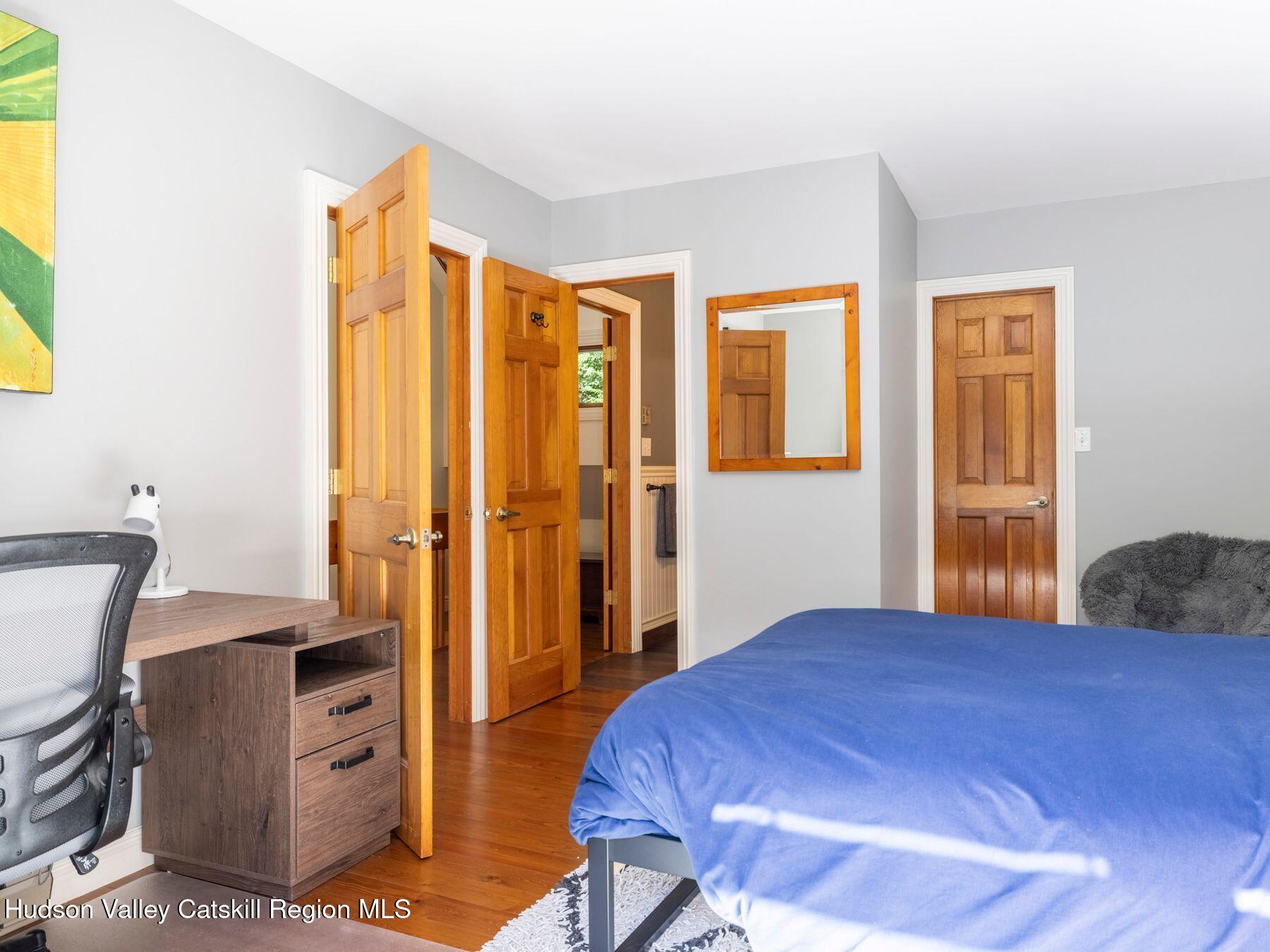 36 Mt Greenery Road Windham, NY 12496 - Photo 28 of 60 a bedroom with a bed and wooden floor
