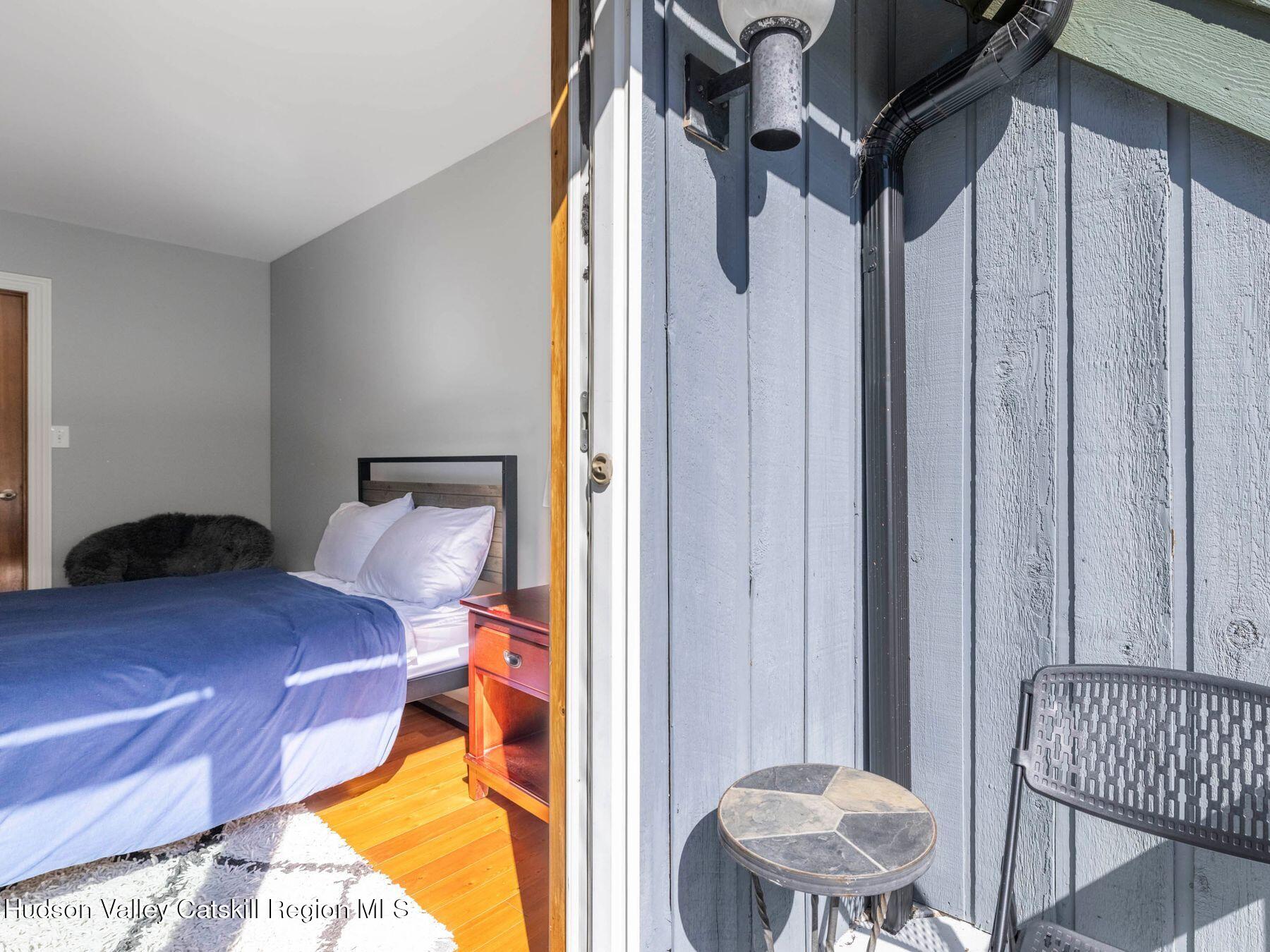 36 Mt Greenery Road Windham, NY 12496 - Photo 30 of 60 a bed room with a bed and a chair