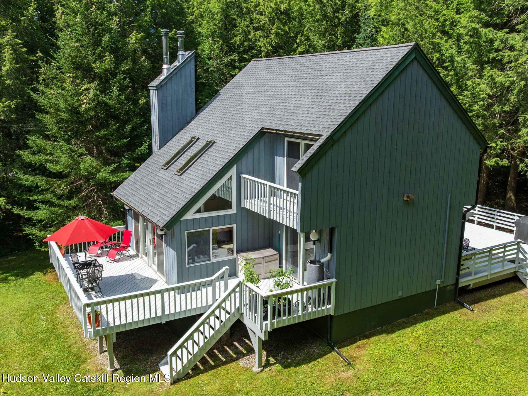 36 Mt Greenery Road Windham, NY 12496 - Photo 3 of 60 a front view of a house with a garden