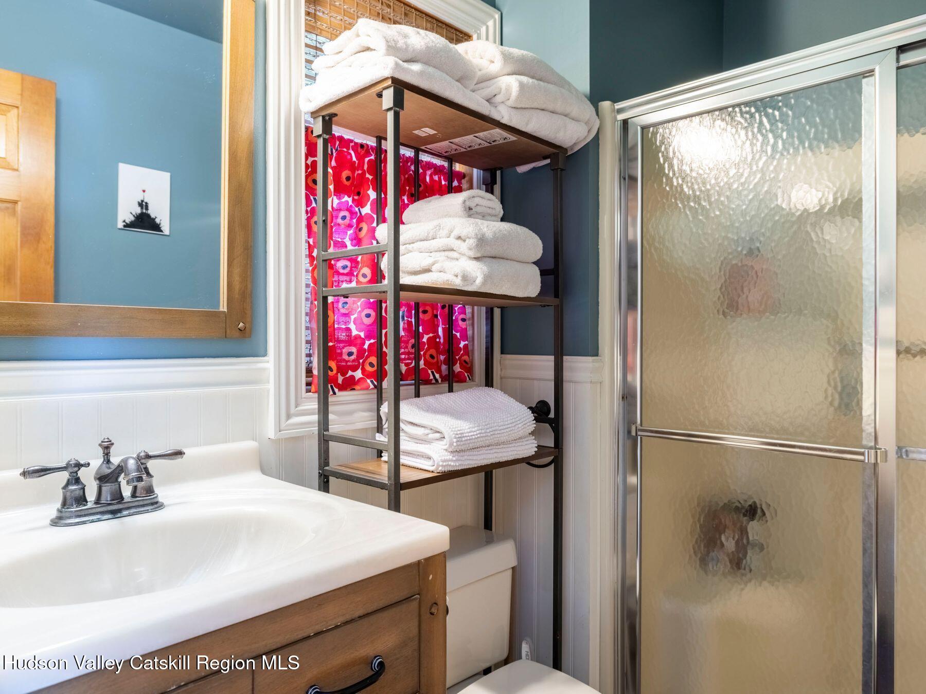 36 Mt Greenery Road Windham, NY 12496 - Photo 32 of 60 a bathroom with a sink and a mirror