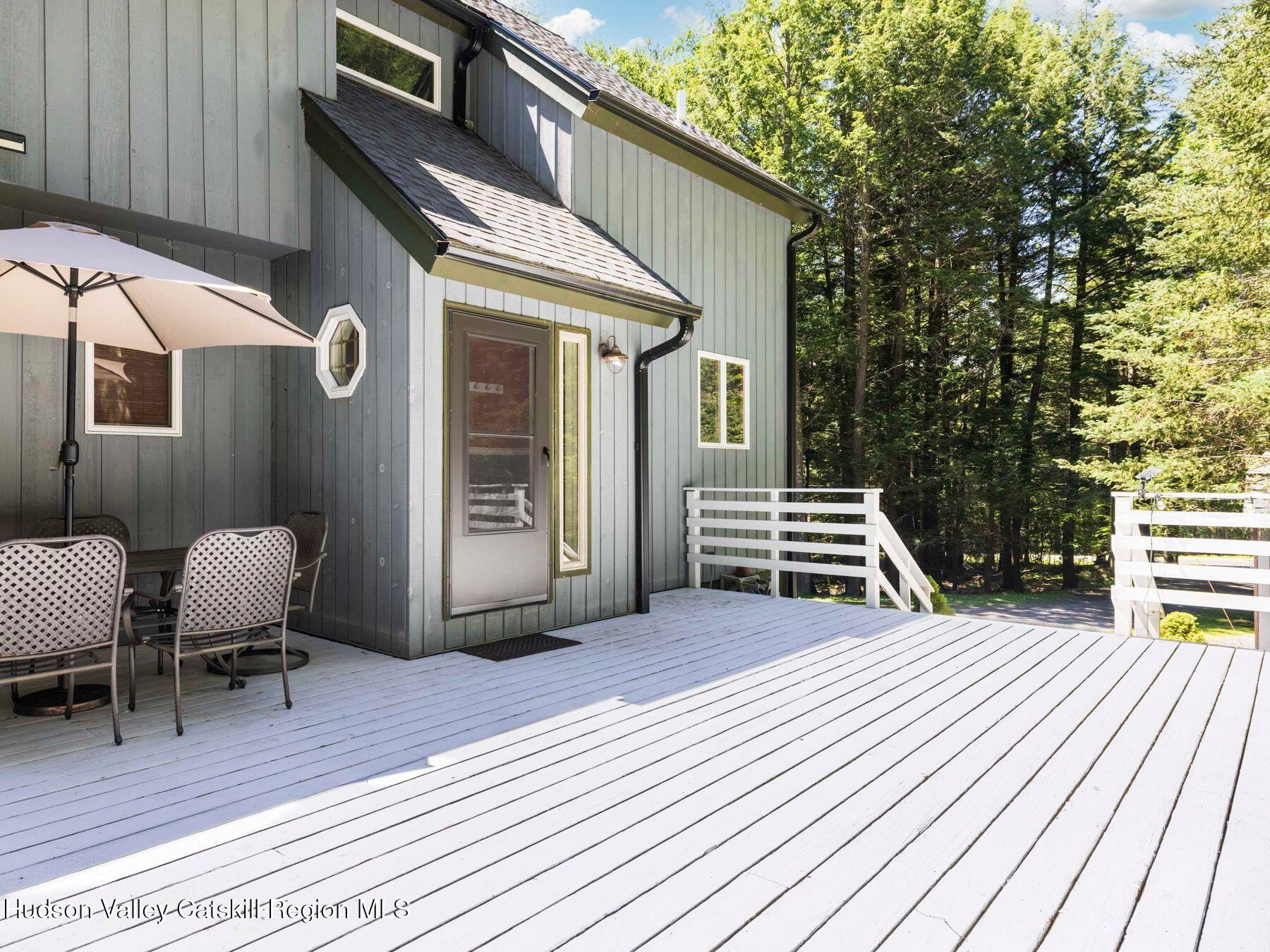 36 Mt Greenery Road Windham, NY 12496 - Photo 41 of 60 a view of a chairs and table on the wooden deck