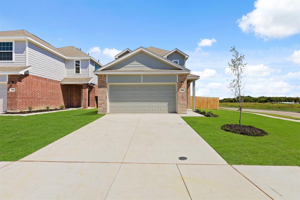 400 Thompson Place Everman, TX 76140 - Photo 1 of 1 a front view of a house with garden