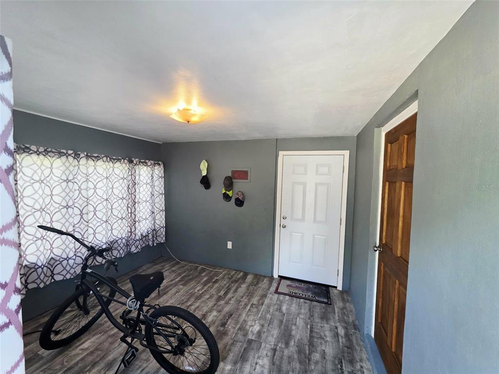 6309 Central Avenue New Port Richey, FL 34653 - Photo 13 of 18 a bedroom with a bed and a window