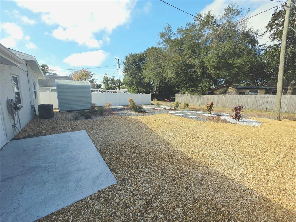 6309 Central Avenue New Port Richey, FL 34653 - Photo 18 of 18 a view of a backyard with wooden fence