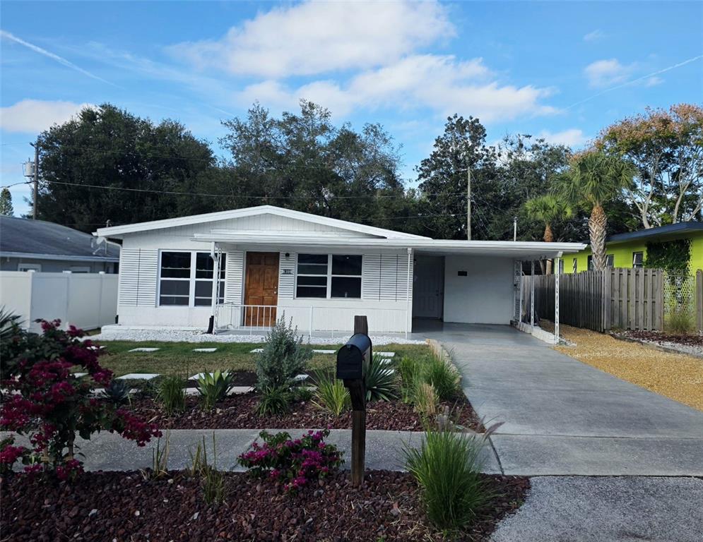 6309 Central Avenue New Port Richey, FL 34653 - Photo 2 of 18 a front view of a house with garden