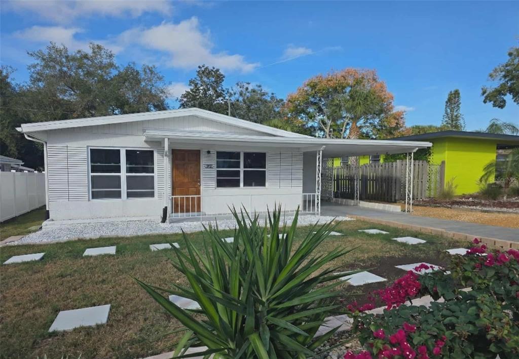 6309 Central Avenue New Port Richey, FL 34653 - Photo 4 of 18 a front view of a house with garden
