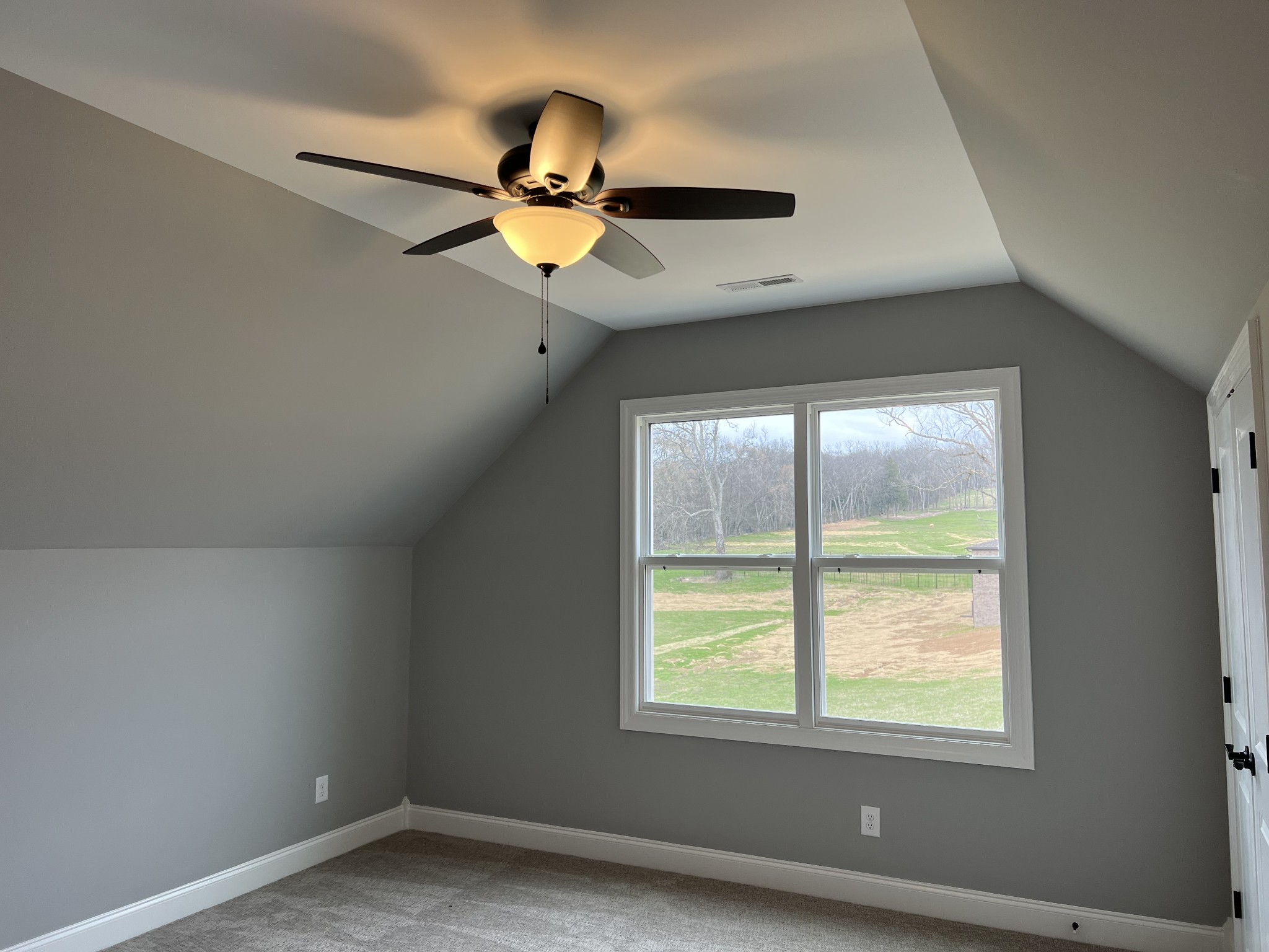 1059 Hideaway Road Columbia, TN 38401 - Photo 14 of 15 an empty room with a window and a ceiling fan