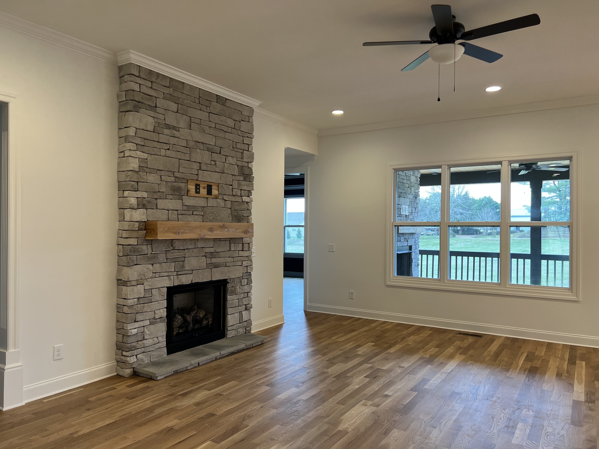 1059 Hideaway Road Columbia, TN 38401 - Photo 3 of 15 a view of an empty room with a fireplace and a window