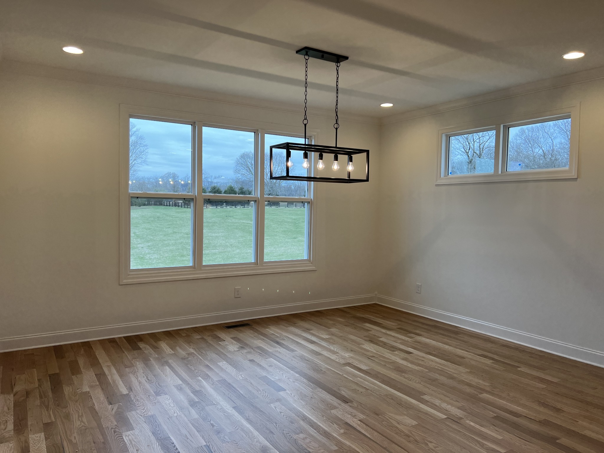 1059 Hideaway Road Columbia, TN 38401 - Photo 5 of 15 a view of an empty room with wooden floor and a window