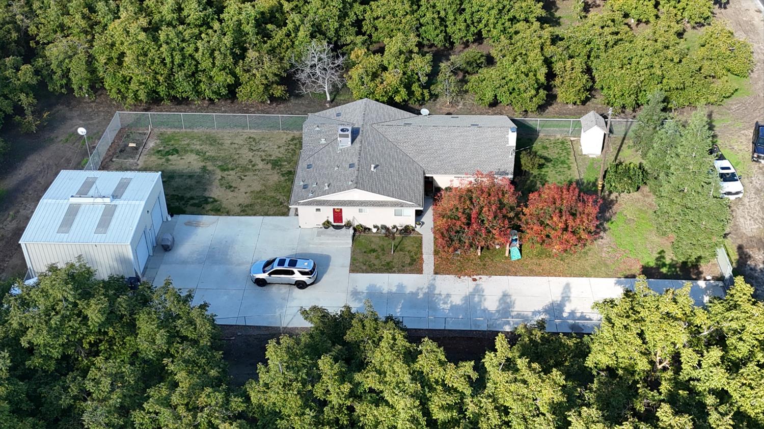 an aerial view of a house with outdoor space