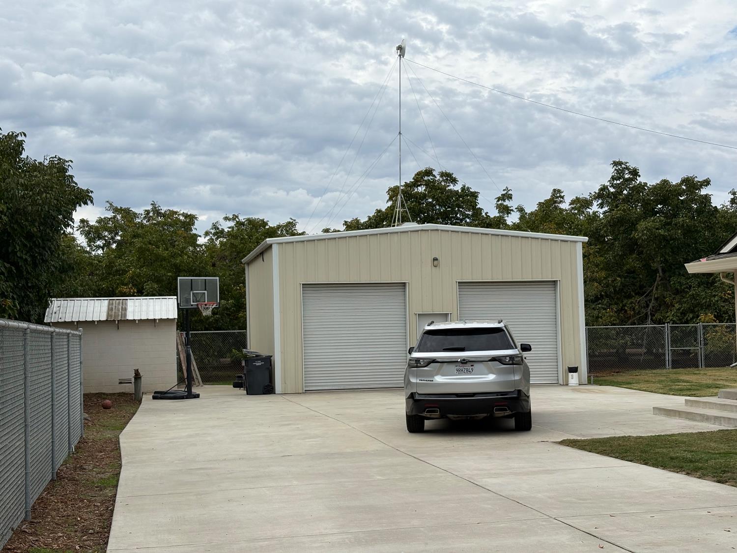 5331 Geer Road Hughson, CA 95326 - Photo 4 of 12 a car parked in front of a white house