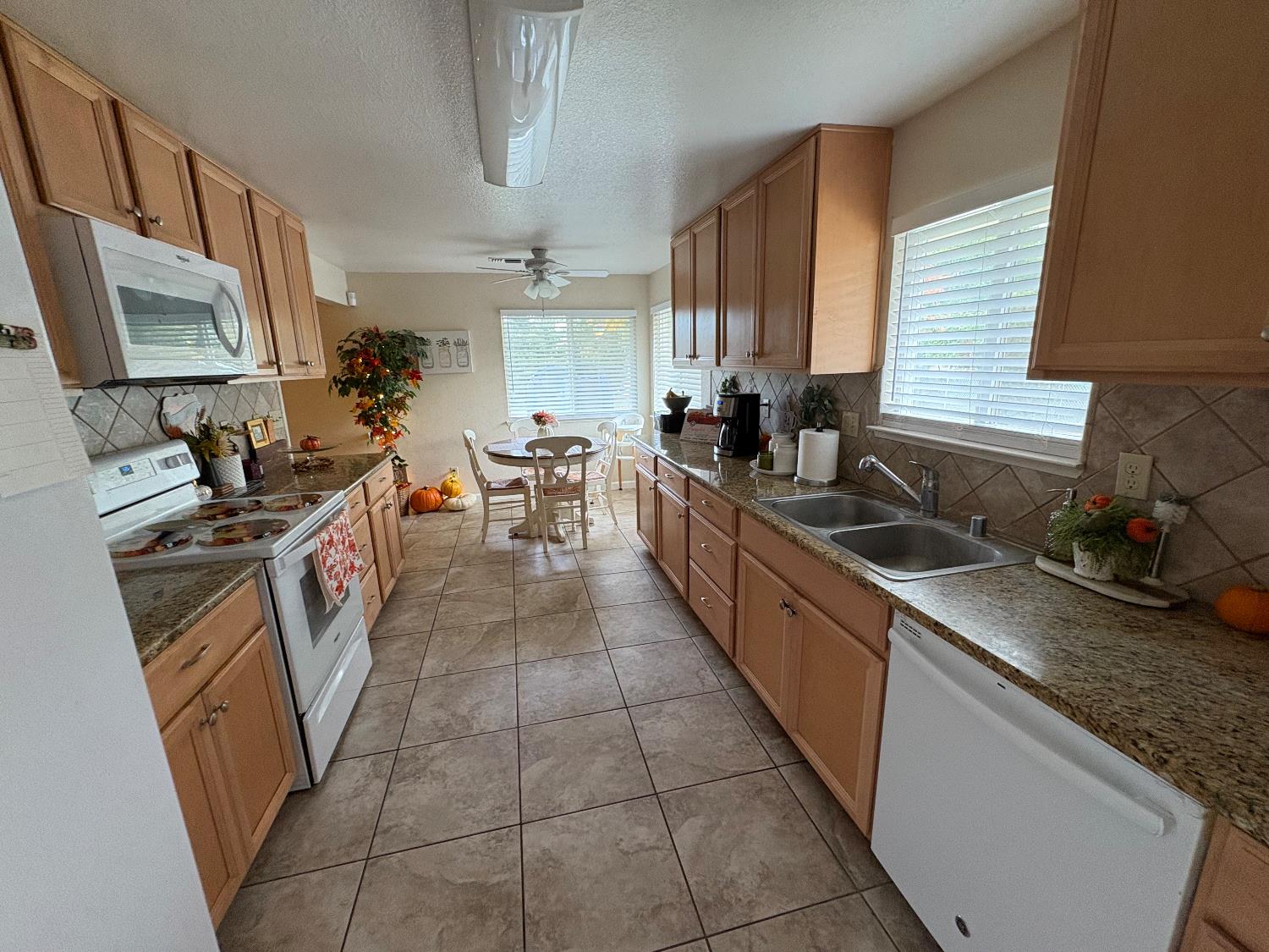 5331 Geer Road Hughson, CA 95326 - Photo 5 of 12 a kitchen with a sink stove and cabinets
