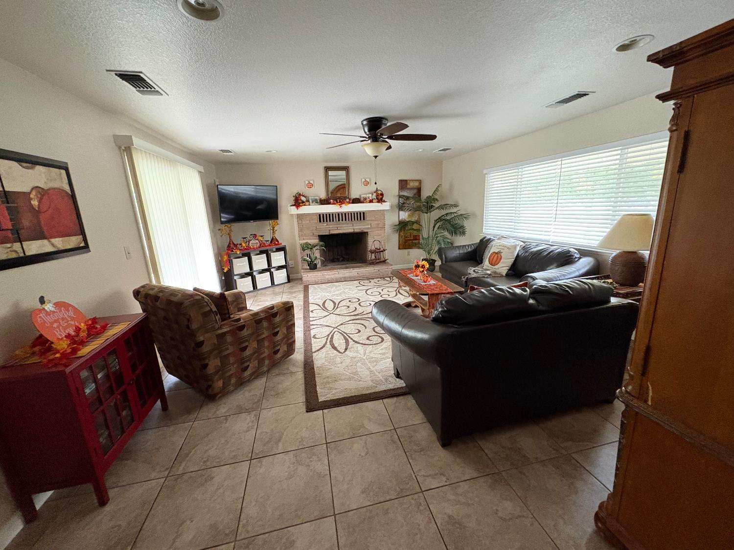 5331 Geer Road Hughson, CA 95326 - Photo 7 of 12 a living room with furniture and a fireplace