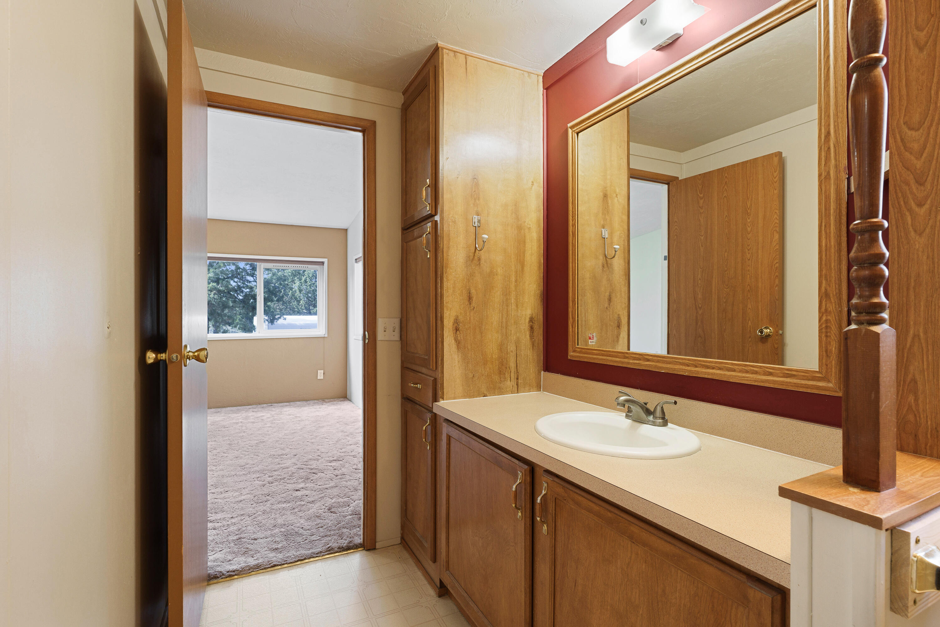 5674 Southeast Davis Loop Prineville, OR 97754 - Photo 21 of 48 a bathroom with a sink and a mirror