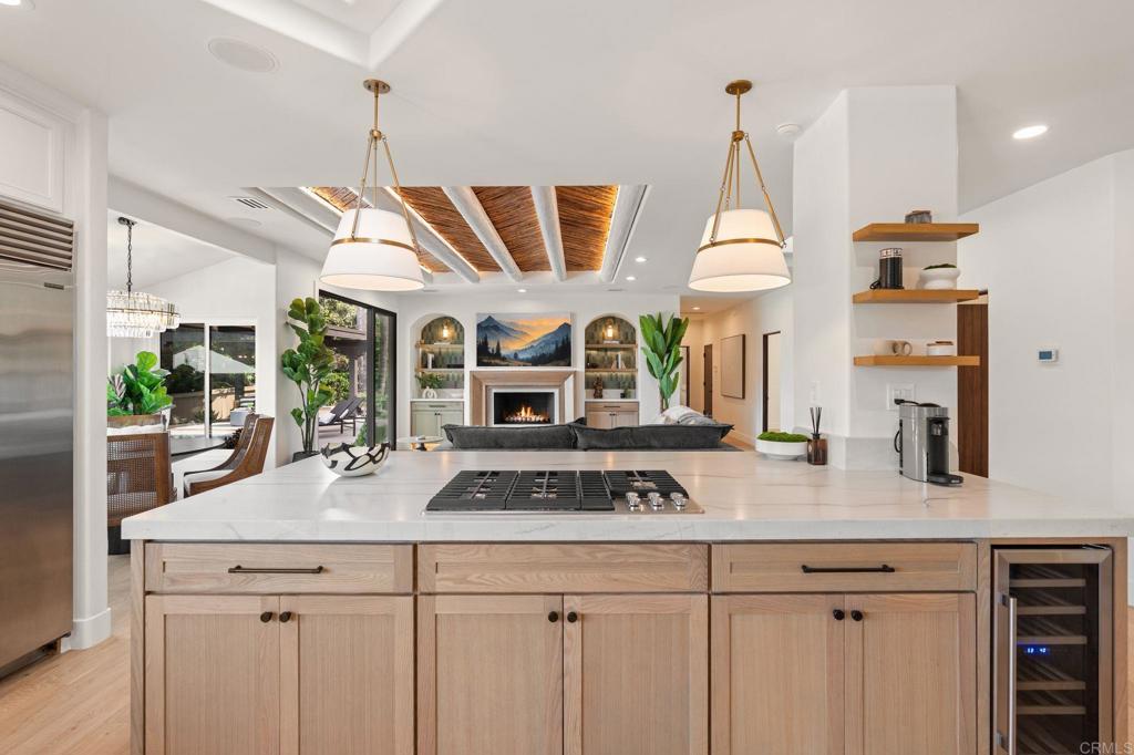 528 Flores De Oro Rancho Santa Fe, CA 92067 - Photo 25 of 75 a kitchen with a table a sink and cabinets