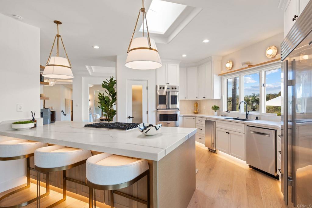528 Flores De Oro Rancho Santa Fe, CA 92067 - Photo 26 of 75 a kitchen with stainless steel appliances granite countertop counter space and a sink