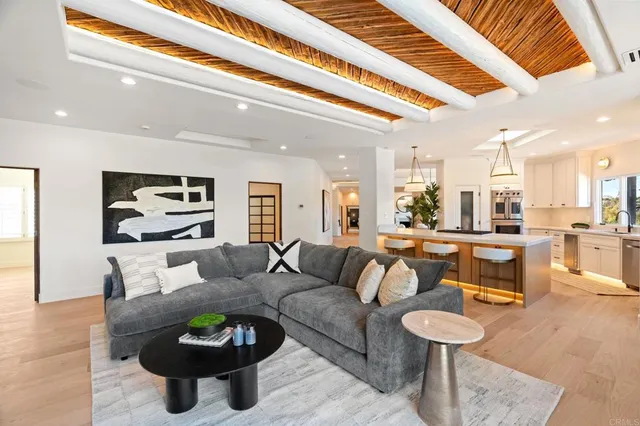 a spacious bedroom with a bed and ceiling fan