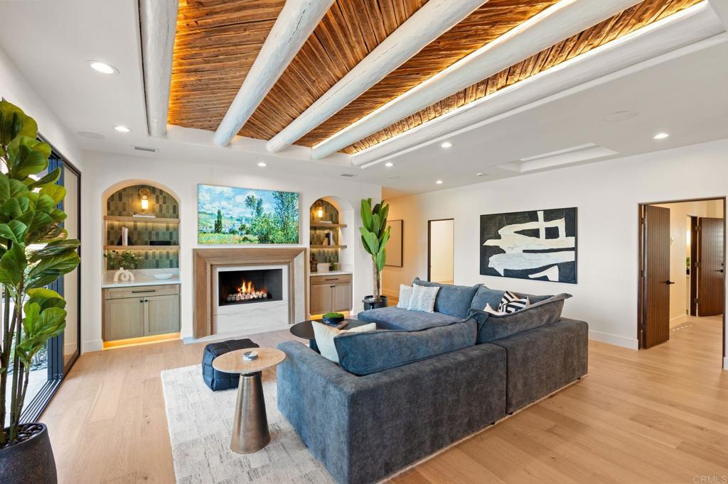 528 Flores De Oro Rancho Santa Fe, CA 92067 - Photo 29 of 75 a living room with furniture and a fireplace
