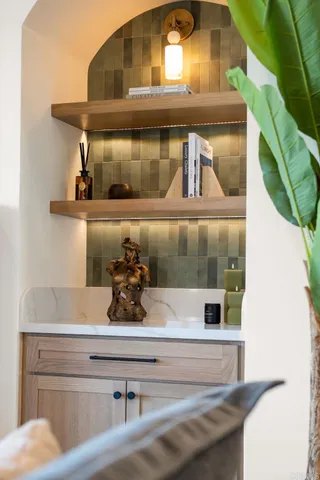 a large white kitchen with stainless steel appliances granite countertop a sink and cabinets