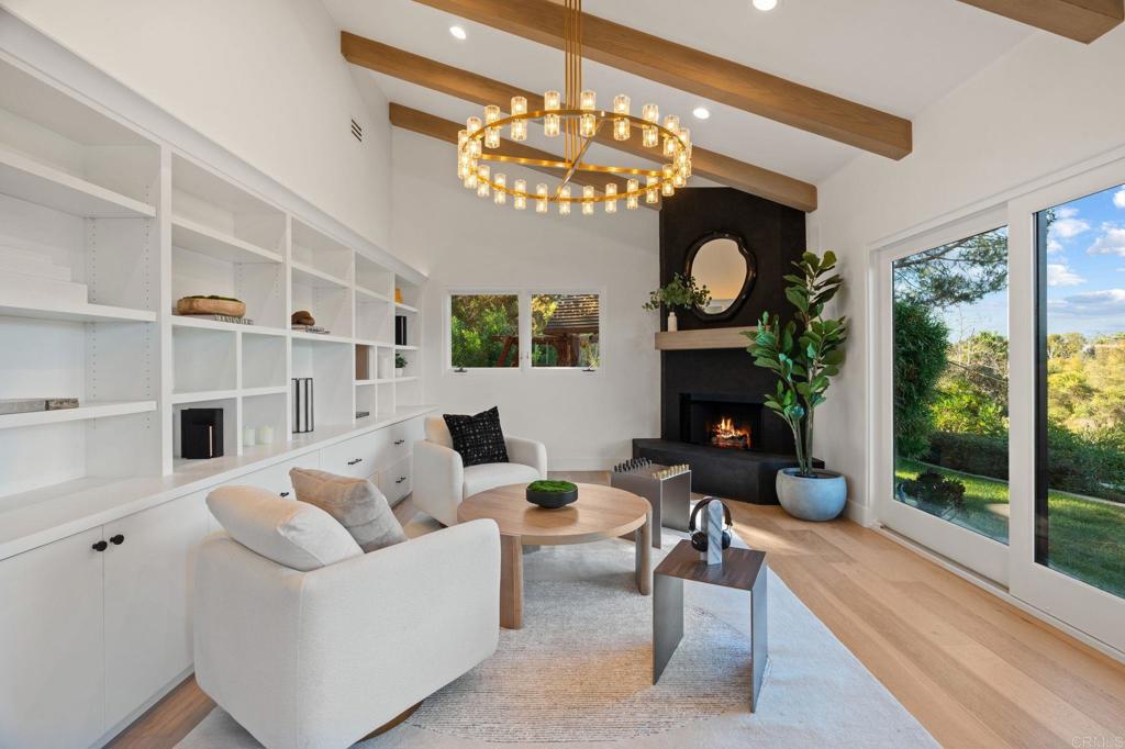 528 Flores De Oro Rancho Santa Fe, CA 92067 - Photo 39 of 75 a living room with fireplace furniture and a large window