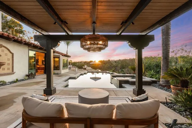 a terrace with outdoor seating and city view