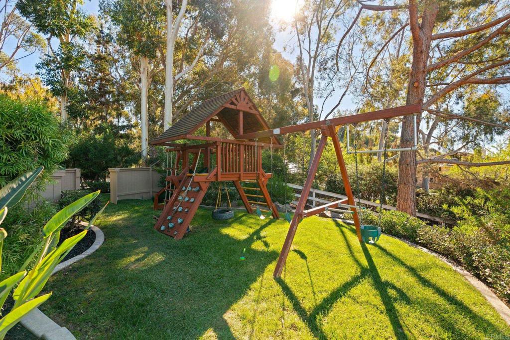 528 Flores De Oro Rancho Santa Fe, CA 92067 - Photo 69 of 75 a view of a swimming pool with a backyard