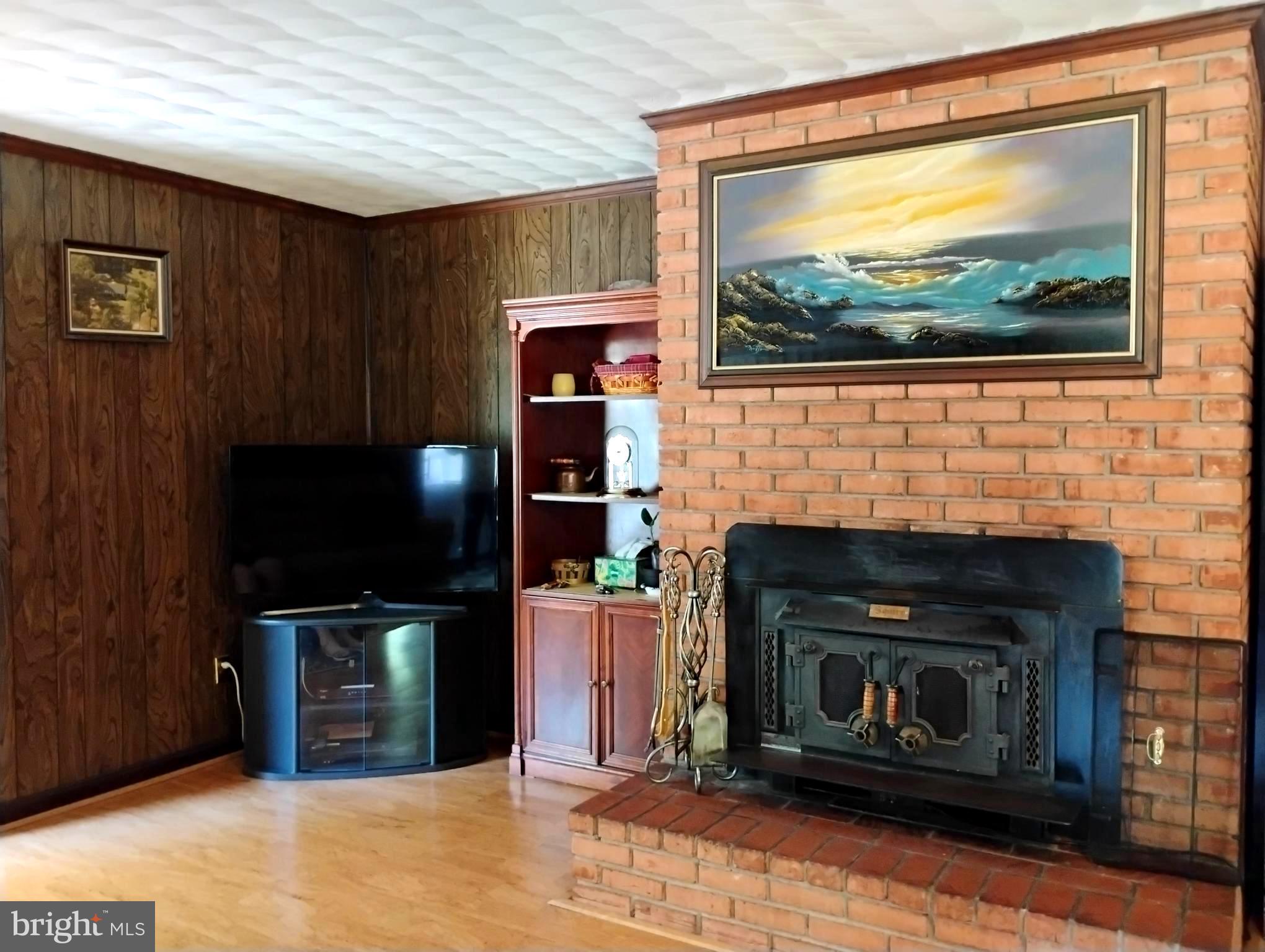 12266 Elk Run Church Road Midland, VA 22728 - Photo 15 of 67 Screen conveys with wood stove