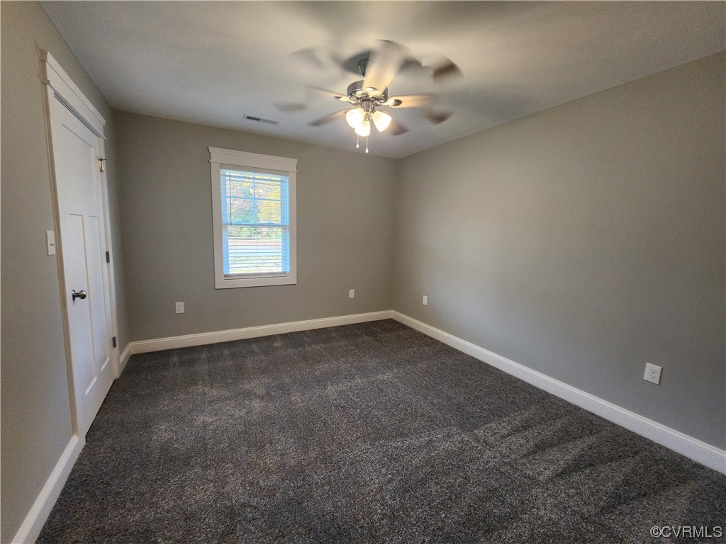 310 Jarratt Jarratt, VA 23867 - Photo 12 of 17 a view of a livingroom with a chandelier fan