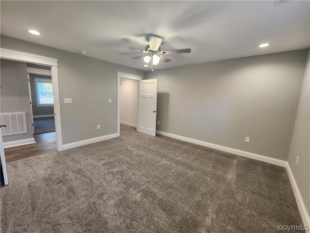 310 Jarratt Jarratt, VA 23867 - Photo 16 of 17 an empty room with closet and a chandelier fan