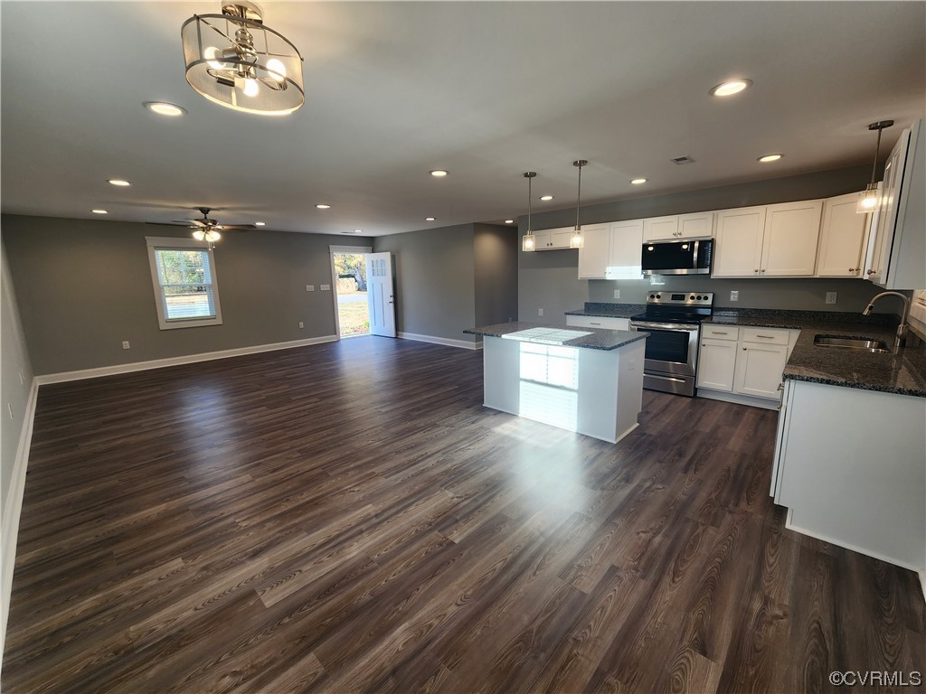 310 Jarratt Jarratt, VA 23867 - Photo 7 of 17 an open kitchen with kitchen island and stainless steel appliances