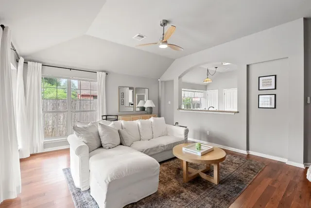 a spacious bedroom with a bed and a window