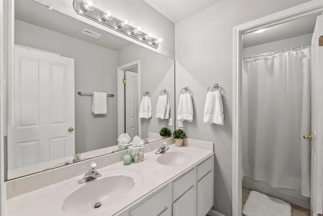 a view of a room that has a bed and a window