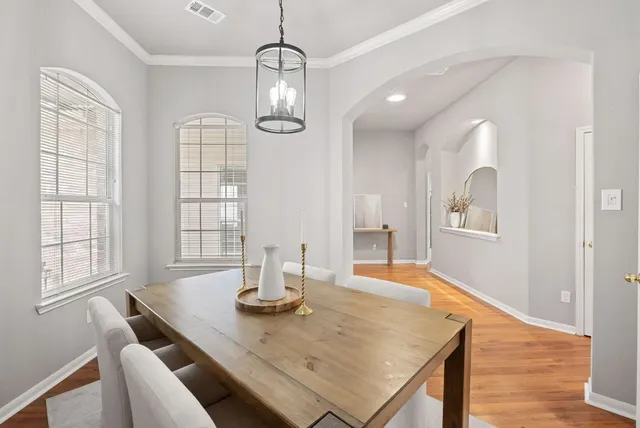 a dining room with wooden floor