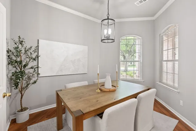 a kitchen with counter top space and windows