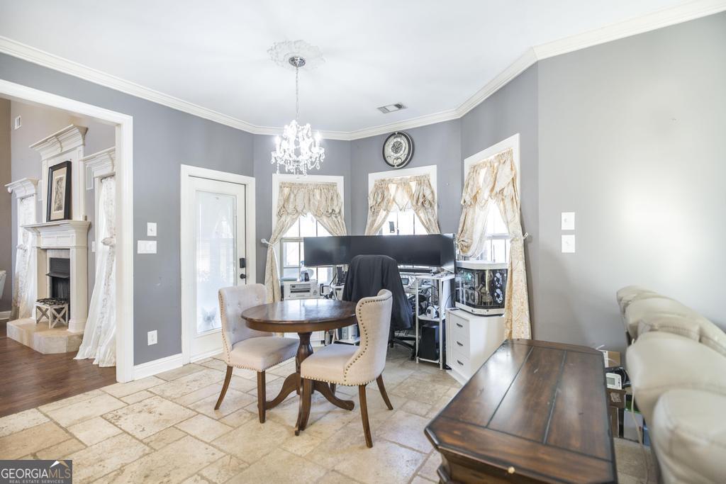 4065 Gordon Road Abbeville, GA 31001 - Photo 18 of 48 a view of a dining room with furniture window and wooden floor