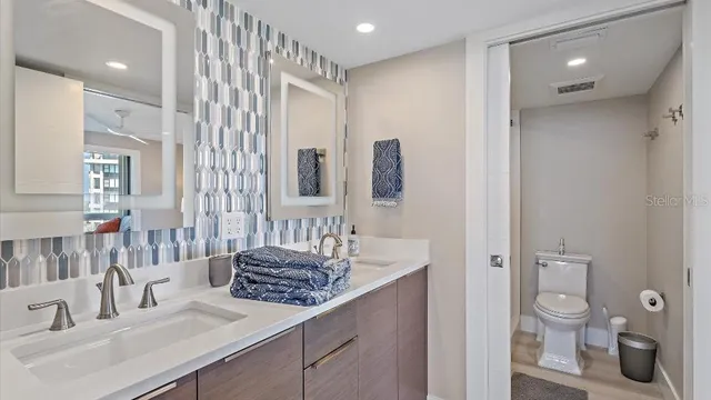 a bathroom with a glass shower door