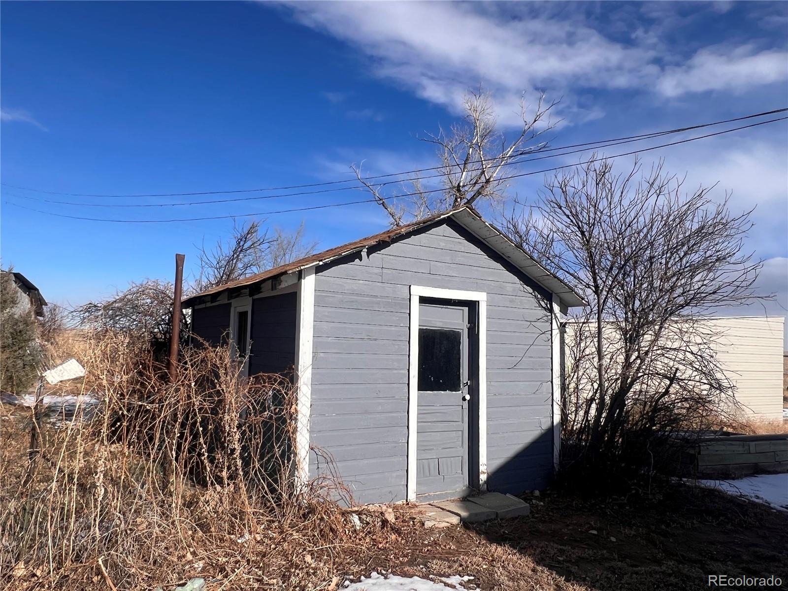 38563 Monroe Street Agate, CO 80101 - Photo 12 of 28 a front view of a house with a yard