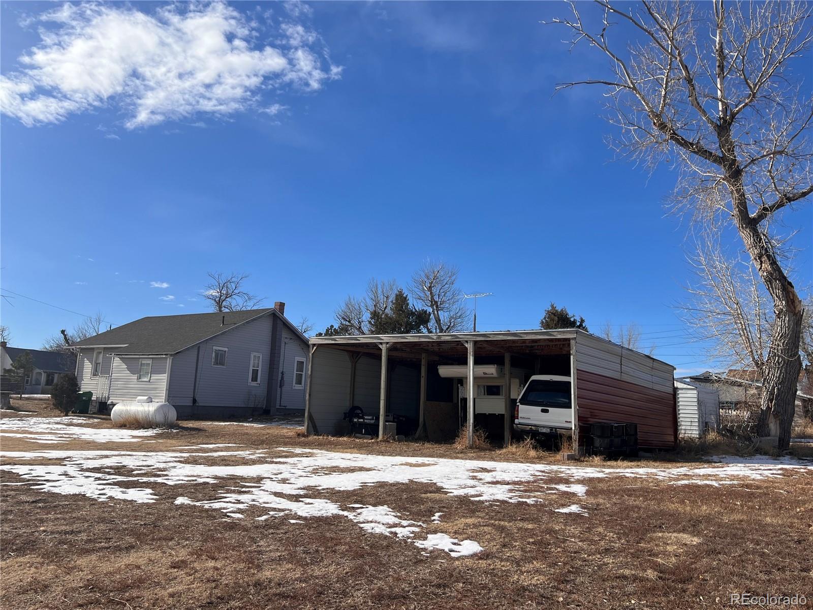38563 Monroe Street Agate, CO 80101 - Photo 15 of 28 a view of a house with a yard and sitting area