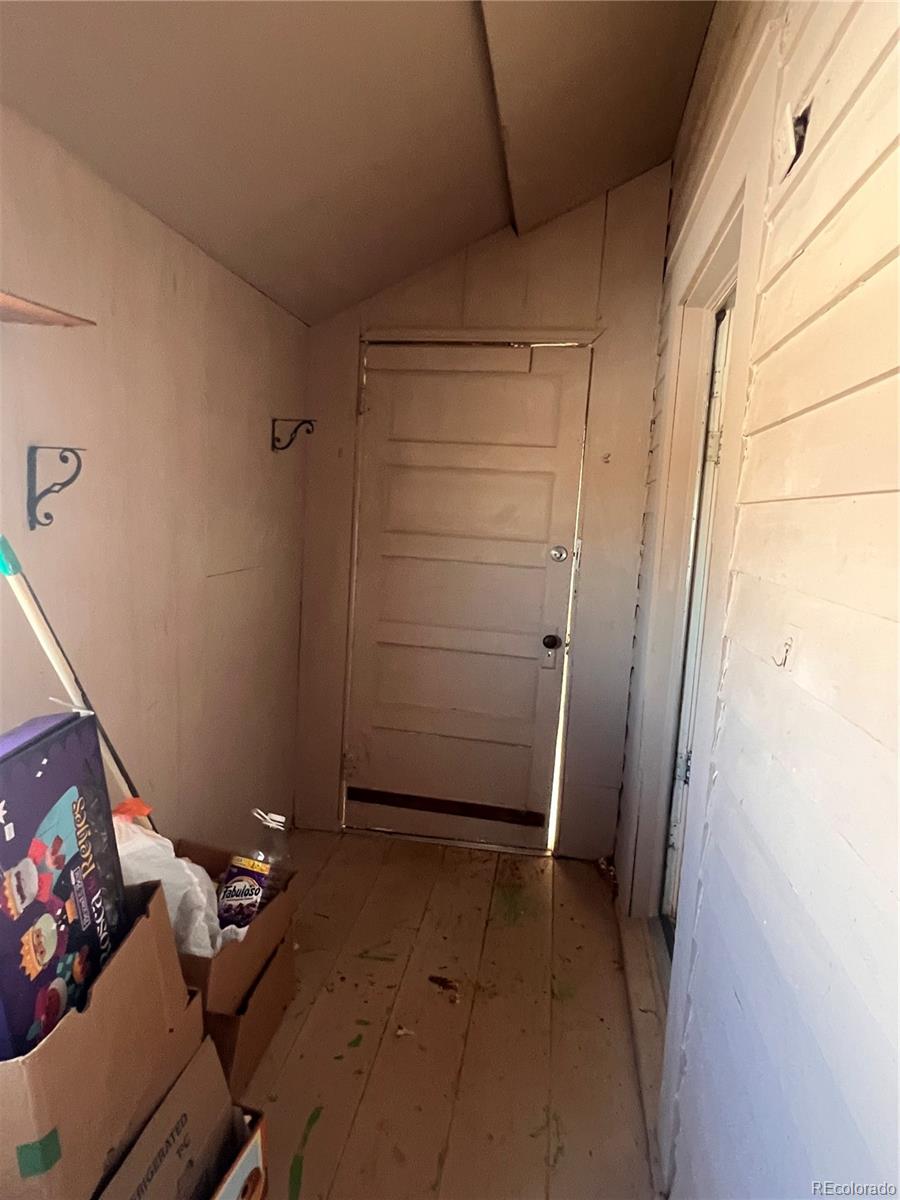 38563 Monroe Street Agate, CO 80101 - Photo 22 of 28 a view of room with hallway