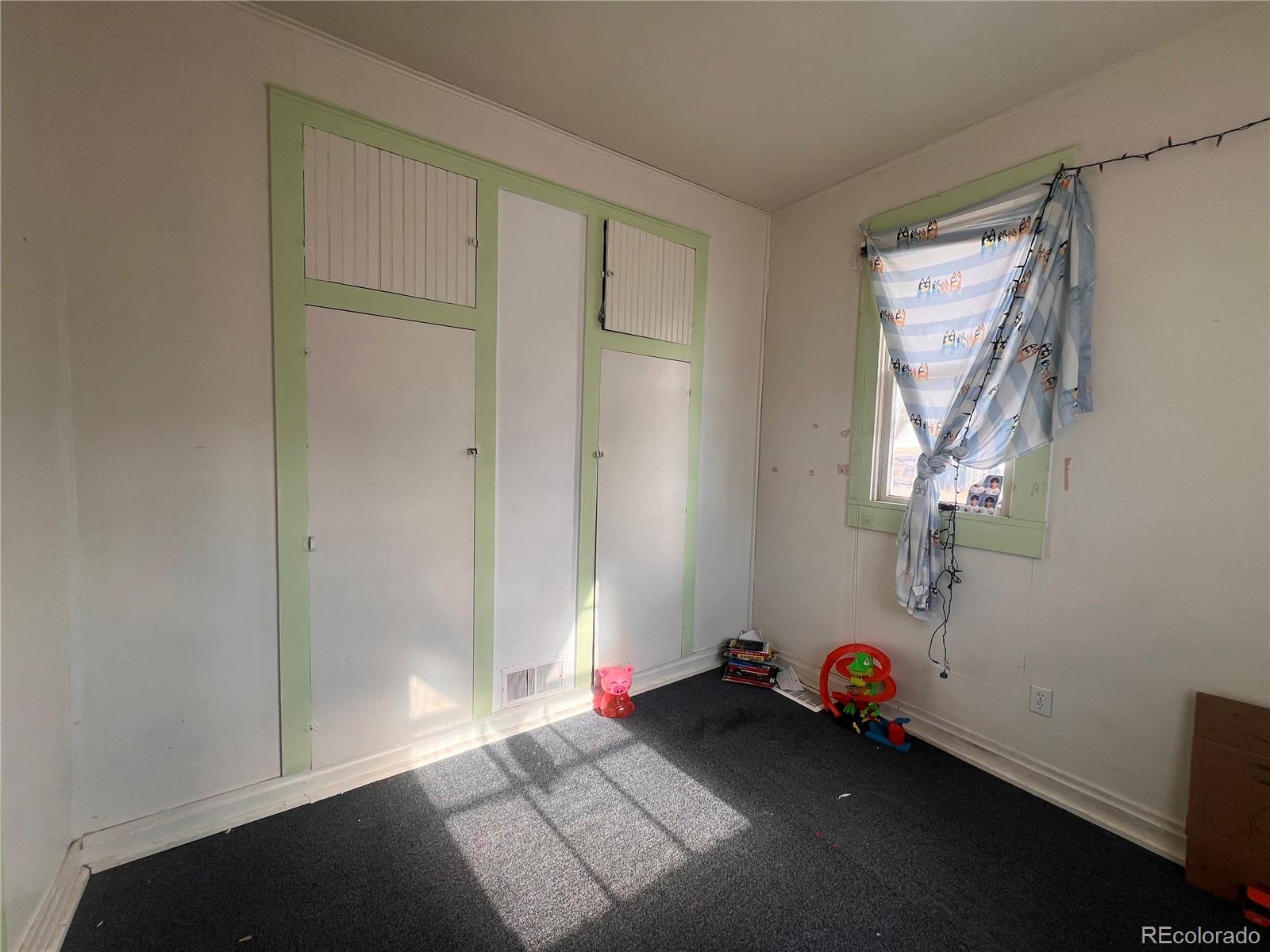 38563 Monroe Street Agate, CO 80101 - Photo 24 of 28 a view of a room with wooden floor and closet